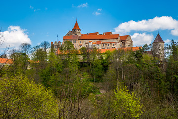 Fototapeta premium Pernstejn Castle stands in the woods on a high rock