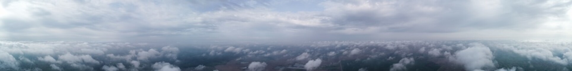 Flight over the clouds, panorama. Weather 