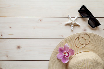 Travel background with accessories: woman hat, tablet, sunglasses, flower.. Vacation concept.