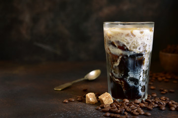 Homemade delicious iced coffee in a tall glass.