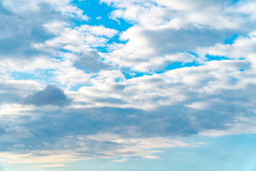 Blue sky with dramatic white puffy clouds
