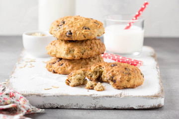 Homemade oatmeal cookies with chocolate and banana, milk in a glass with a tube. Delicious dessert, Breakfast (lunch), healthy food, pastries for children
