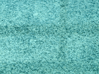 Fototapeta na wymiar Texture of the floor made of polished granite