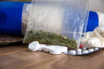 drug smuggling - a lot of drugs: cocaine, heroin, marijuana, amphetamines are on the table, short...