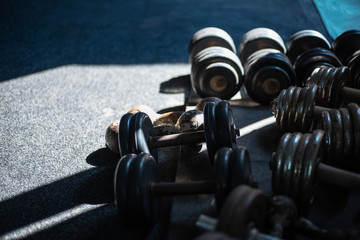 Close-up of gym dumbbells with sunlight