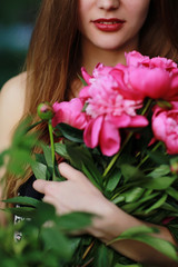 Obraz na płótnie Canvas Bouquet of Peony. Stylish fashion photo of beautiful young woman lies among peonies. Holidays and Events. Valentine's Day. Spring blossom. Summer season