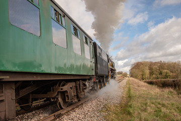 Fototapeta na wymiar Vintage steam train and carriages.