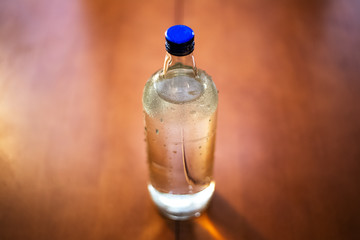Close-up of glass bottle with water