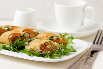 Fresh rolls with cheese, red fish and salad.