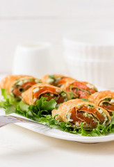 Fresh rolls with cheese, red fish and salad.