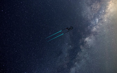 Science Fictional image of a starship in deep space and milky way on the background. Wallpeprer.