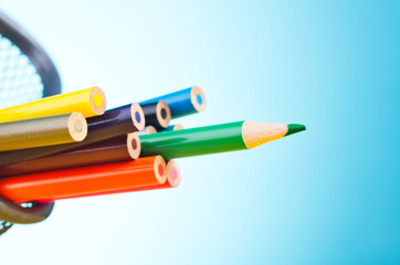 close-up image of colourful pencils over beautiful reverberation gradient background