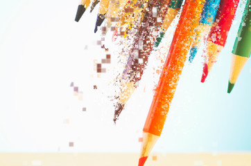 close-up image of colourful pencils over beautiful reverberation gradient background