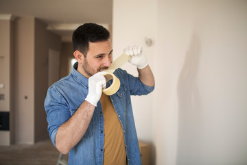 Young man renovating his apartment.