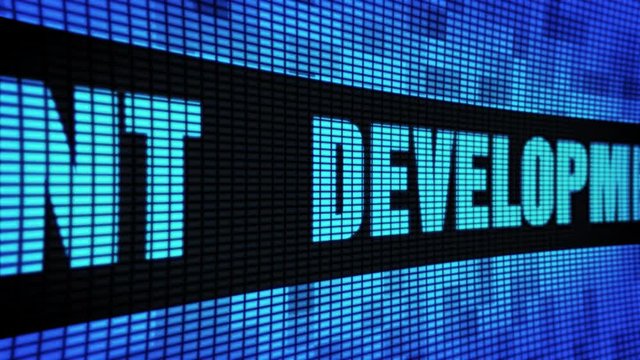 Development Side Text Scrolling on Light Blue Digital LED Display Board Pixel Light Screen Looped Animation 4K Background. Sign Board , Blinking Light, Pixel Monitor, LED Wall Pannel