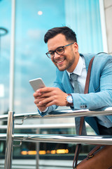 Modern businessman using smart phone