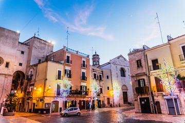 Fototapeta premium Bari, Italy - March 10, 2019: Square of the Cathedral of San Sabino de Bari, illuminated at the anocher.