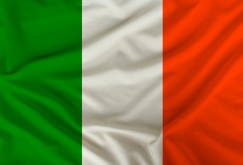 Irish colored flag depicted on silk fabric with soft folds