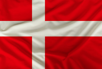Danish colored flag depicted on silk fabric with soft folds