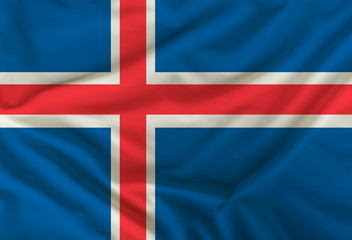 Fototapeta premium national flag of iceland on silk fabric with soft folds, background