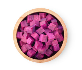 purple yams slice in wood bowl on isolated white background. top view