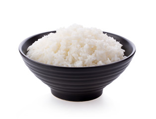 Rice in a black bowl on a white background
