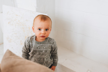 Fototapeta premium Cute little toddler boy looking straight into the camera