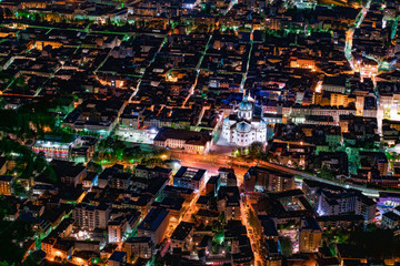 the beautiful Italian city of Como seen from above in a photograph depicting its streets and buildings in front of the lake &nbsp;