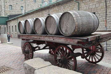 Fototapeta na wymiar Barrels on the wagon wheel
