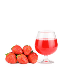 a glass of strawberry flavoured liquor with strawberries isolated and white background