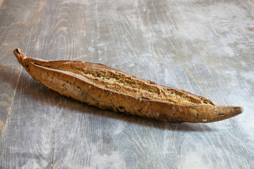 Traditional French baguette, a ficelle flute type, a thin version with seeds and grains, on display...