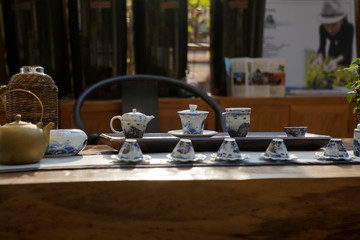 A set of tea sets placed on a tea table