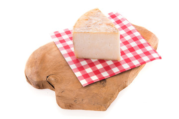 Goat cheese on cutting board