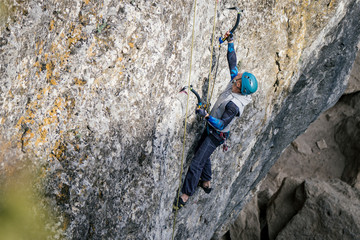 Climbing man on a rock.