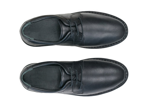 A pair of classic black leather men's shoes isolated on white background. The view from the top.