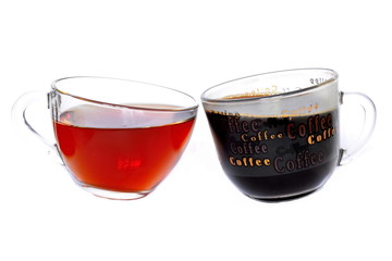 Pair of glass cup of hot golden tea and black strong coffee tilted towards each other on white...