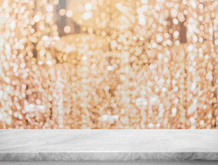 Empty white marble stone table top and blurred golden bokeh lighting decoration background - can used for display or montage your products.