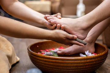 Obraz na płótnie Canvas Spa treatment female feet is a healing for relaxation, comfort, clean. spa concept.