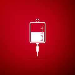 IV bag icon isolated on red background. Blood bag icon. Donate blood concept. The concept of treatment and therapy, chemotherapy. Vector Illustration