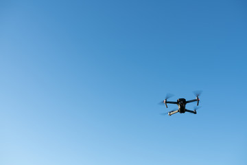 Drone being flown over rural landscape
