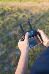 Perosn operating a drone in a rural setting
