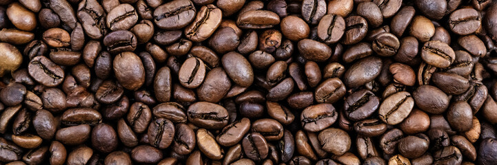 Coffee grains. Background of roasted coffee beans brown. layout. Flat lay.
