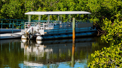 Pontoon Boat Docked at Lake in a Public Park