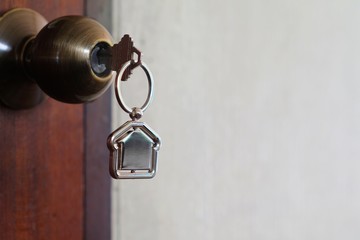 House key with home keyring in keyhole