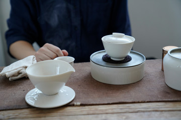 Tea wares placed on wooden shelves and tables