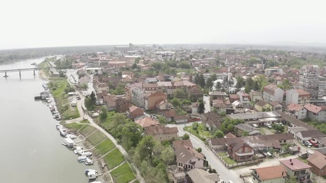 Forwarding the drone to film beautiful river Sava in small city Brcko district in Bosnia and Herzegovina, very nice and log coast. The city lying next to the river, peoples walking. 4k