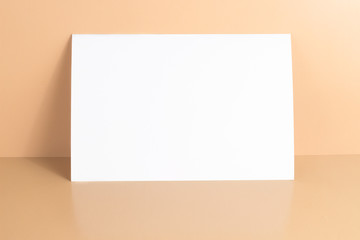 One blank white postcard / flyer / invitation mock-up on yellow background