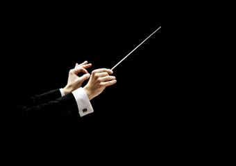  Hands of conductor on a black background