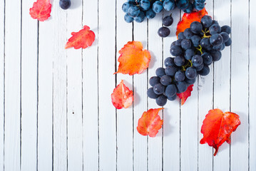red grapes on white wood table