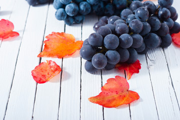 red grapes on white wood table